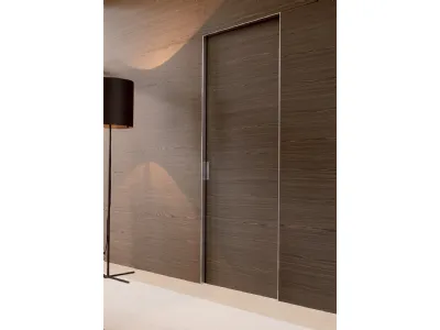 Porta a scomparsa in noce canaletto con profili in alluminio Quadra di Albed