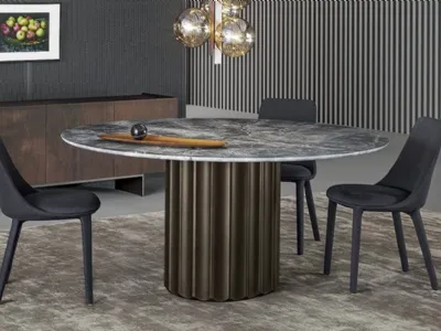 Tavolo Dorian Table con top in marmo e base in poliuretano finitura bronzo spazzolato di Bonaldo